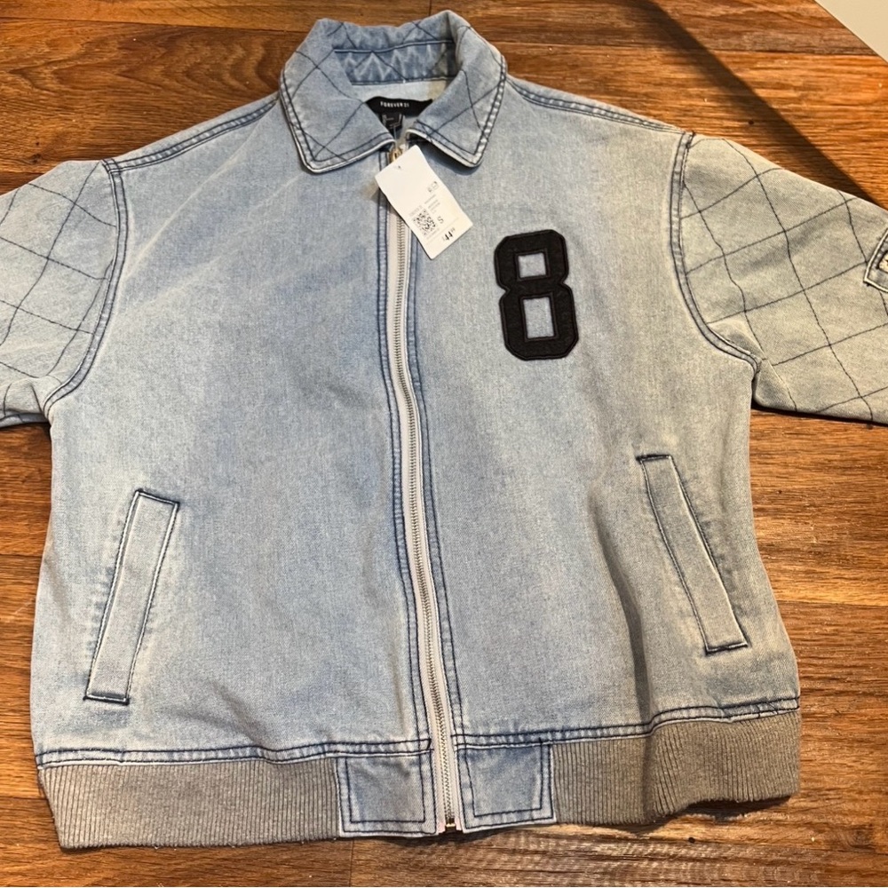 Oversized Light Blue Denim Jacket with Black Patch